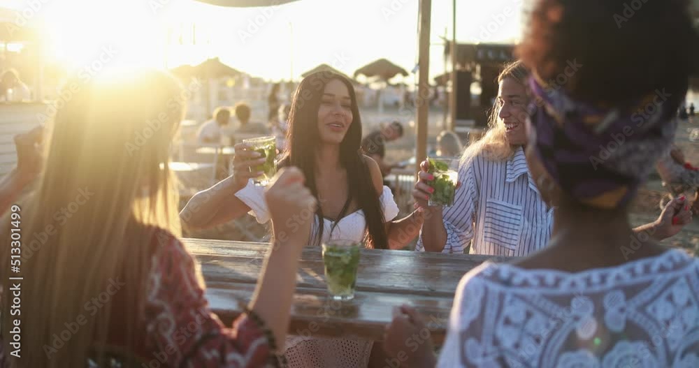 Multiracial friends having fun dancing together outdoor at beach party ...