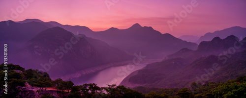 Scenic view of mountains against sky during sunrise