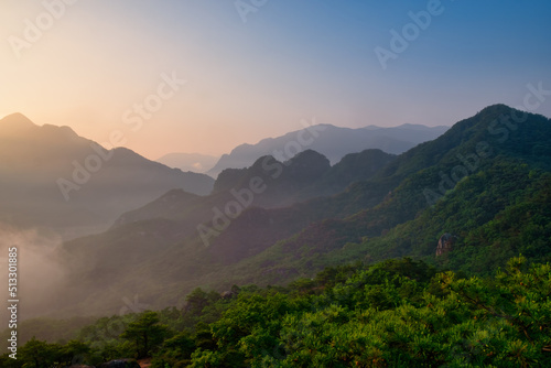 Scenic view of mountains against sky during sunrise