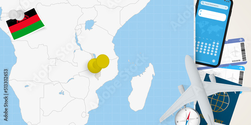 Travel to Malawi concept, map with pin on map of Malawi. Vacation preparation map, flag, passport and tickets.