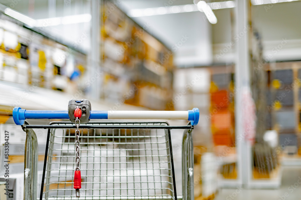 A shopping cart in a home improvement store A shopping cart in a home improvement store