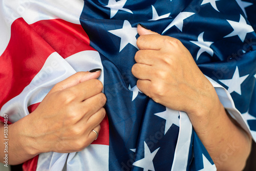 Young woman holding American flag 