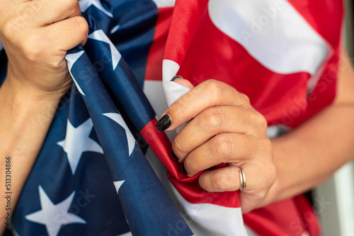 Young woman holding American flag 