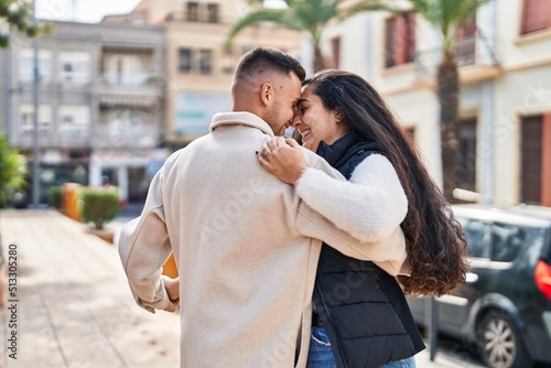 Man and woman smiling confident dancing at street