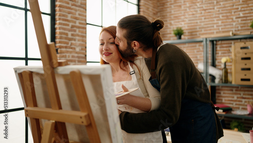Man and woman couple smiling confident drawing at art studio