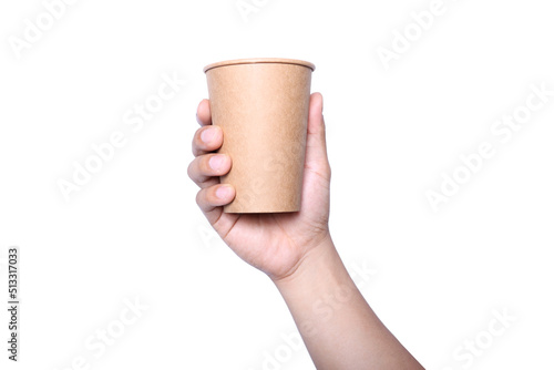 Man's hand holding a paper cup on a white background with a concept of using paper to reduce global warming.Mockup of man holding a paper cup.Clipping path.