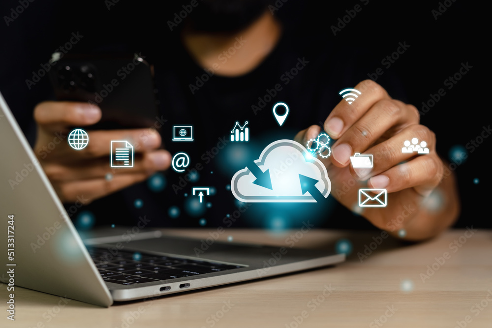 Concept of data cloud computing. Man using laptop holding pen finger point at data cloud icons analysis technology. connect devices information technology server innovation virtual. 