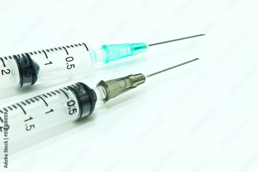 3 ml Plastic Syringe with Needle Isolated on the White Background 3 ml Plastic Syringe with Needle Isolated on the White Background