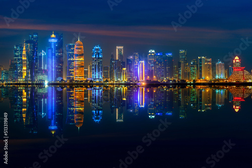 Panoramic skyline of Doha city at night, Qatar. photo