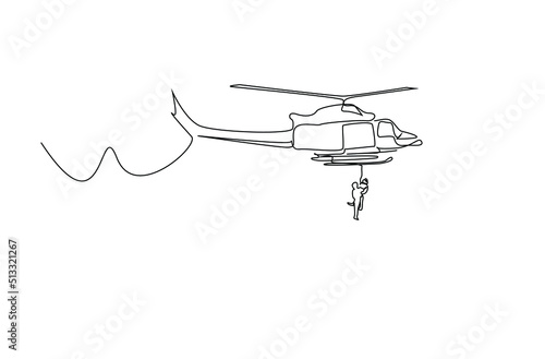 A rescue worker hanging from a helicopter rescues a person