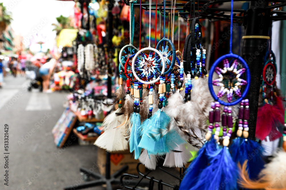 Market stall, photo of handmade dream catchers made of different colors, at the Fogueras festivities in ALicante.