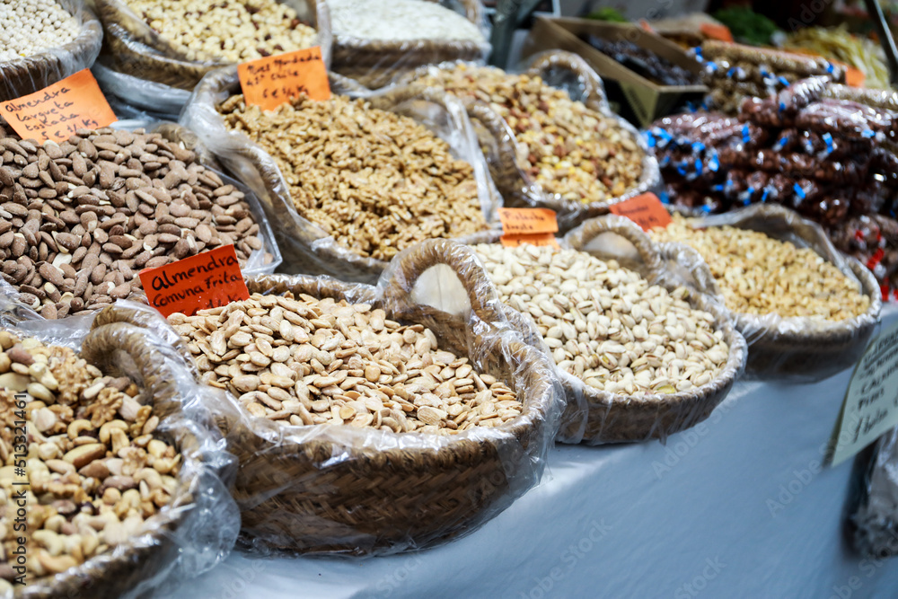 A stall selling a variety of nuts and dried fruit at the Alicante fogueras festivities flea market. A stall selling a variety of nuts and dried fruit at the Alicante fogueras festivities flea market.