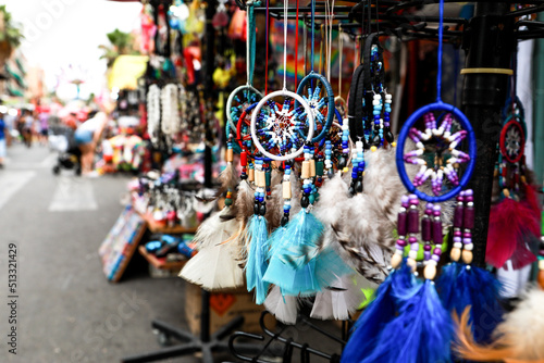 Market stall, photo of handmade dream catchers made of different colors, at the Fogueras festivities in ALicante.