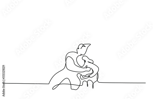 a father hugs and comforts his sad crying son