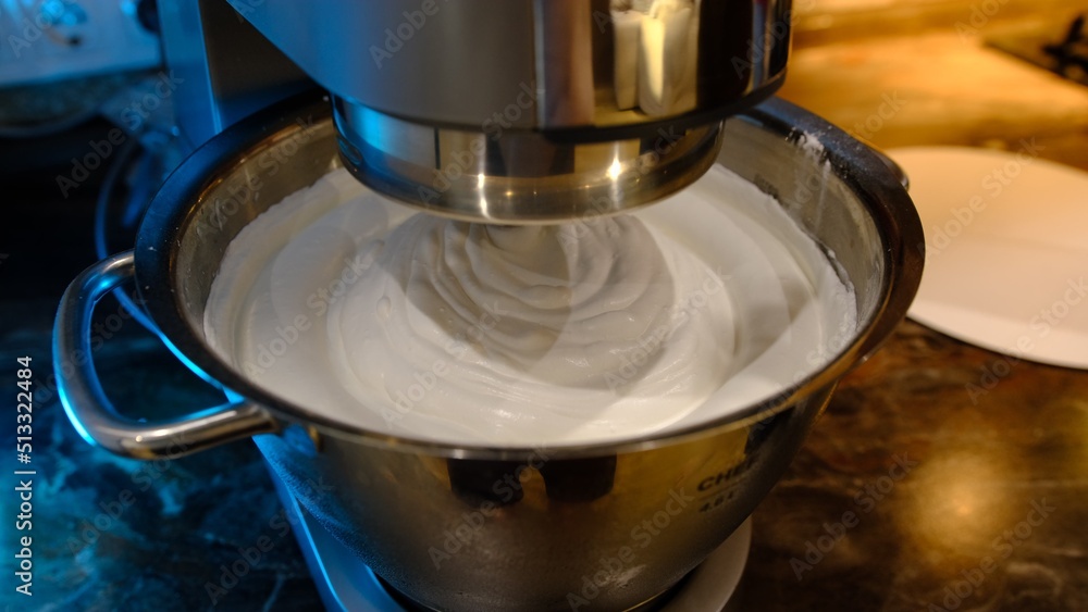 Beaten egg cream whites until frothy. Whipped egg whites for a meringue. Red stationary mixer, food processor take out beater Beaten egg cream whites until frothy. Whipped egg whites for a meringue. Red stationary mixer, food processor take out beater