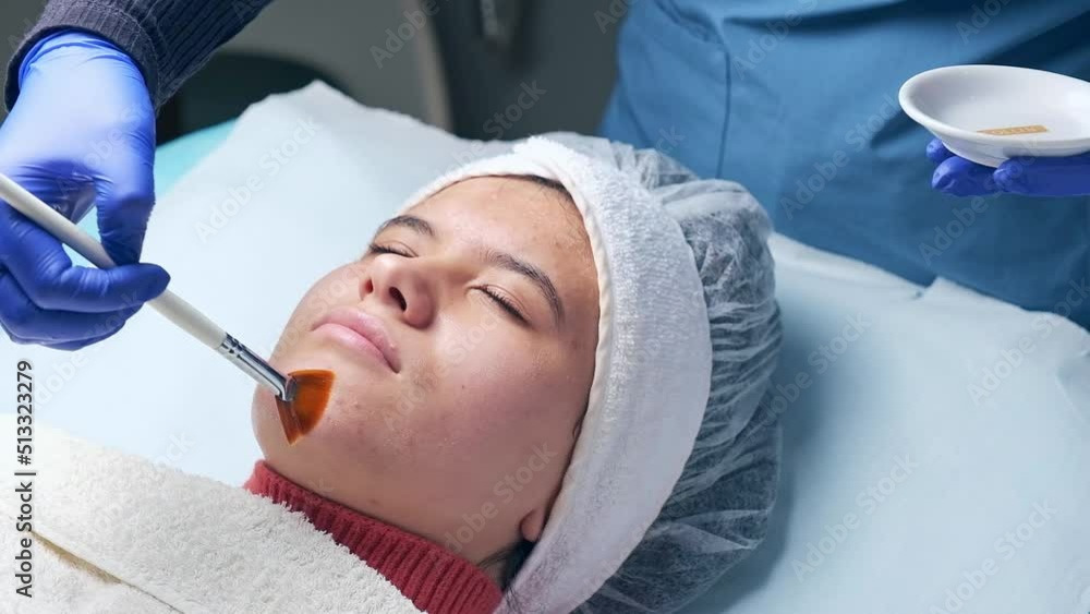 young girl getting a chemical peeling an aesthetic clinic young girl getting a chemical peeling an aesthetic clinic