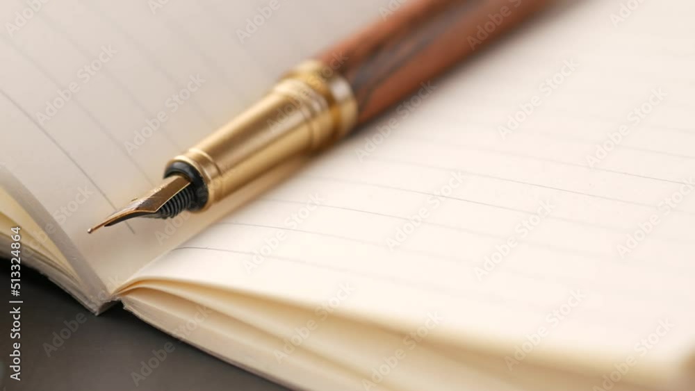 old empty paper and fountain pen on table old empty paper and fountain pen on table