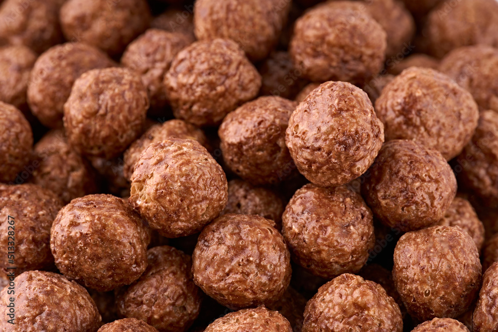 Variety of cold cereals, quick breakfast for kids overhead shot. Quick breakfast. Chocolate balls isolated on a white background. Rings isolated on a white background. Variety of cold cereals, quick breakfast for kids overhead shot. Quick breakfast. Chocolate balls isolated on a white background. Rings isolated on a white background.