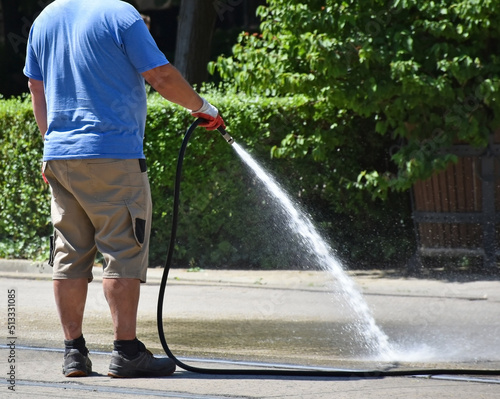 Man is watering on the street