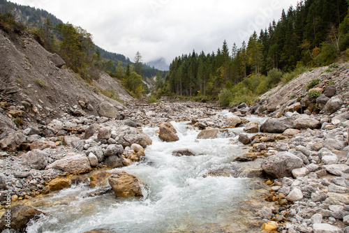 Water stream at the Karwendel mountains in Eng, Austria. Closeup of the water stream with rocks