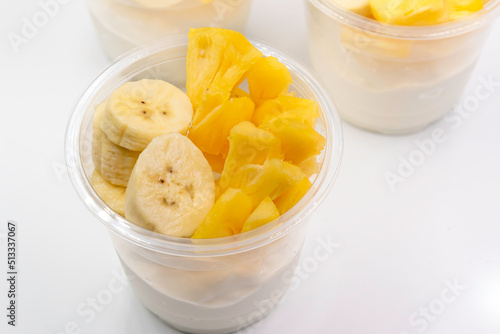 Bowl of fresh yogurt with fruit served for good health.
