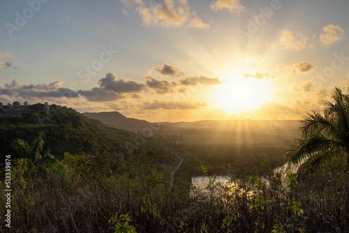 Yumuri River surrounded by trees at sunset in Matanzas, Cuba photo