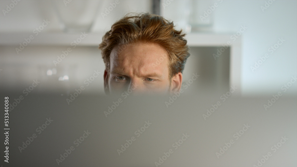 Focused businessman looking computer monitor at home remote workplace closeup. 