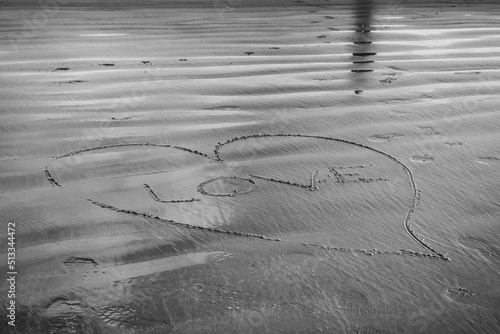 Wallpaper Mural Love sign in sand at low tide with reflection