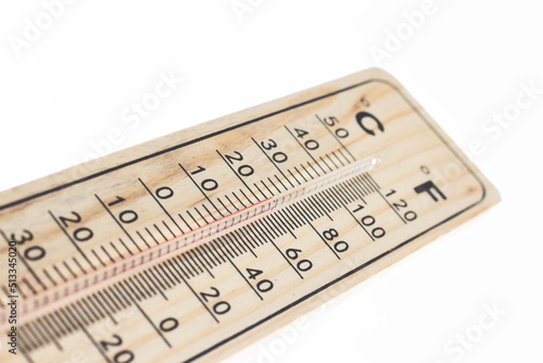 A wooden temperature thermometer isolated against a pure white background with red mercury