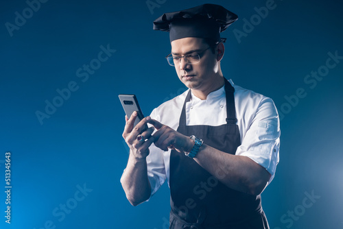 Chef with phone. Man employ...