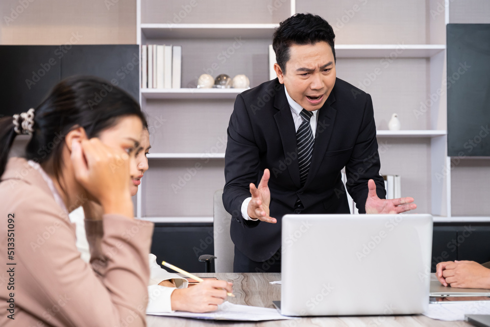 Asian men manager scold and angry with their employee inside of office meeting room with upset and stress worker. Business failure. Problem in working office issue. Asian men manager scold and angry with their employee inside of office meeting room with upset and stress worker. Business failure. Problem in working office issue.