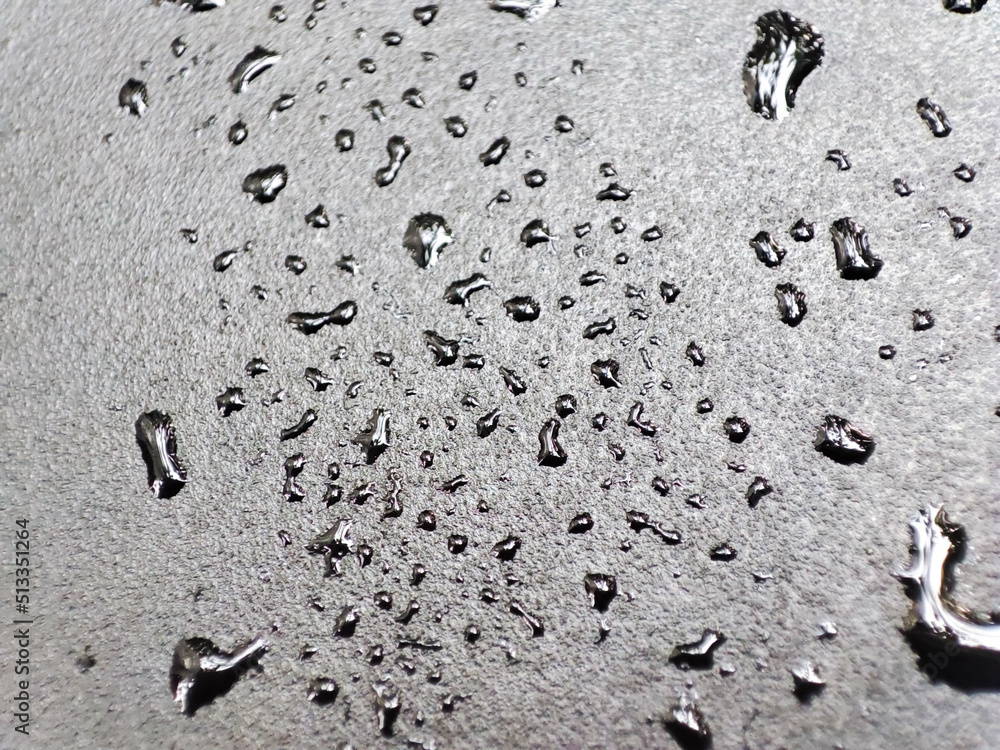 Water splash on a black aluminium table