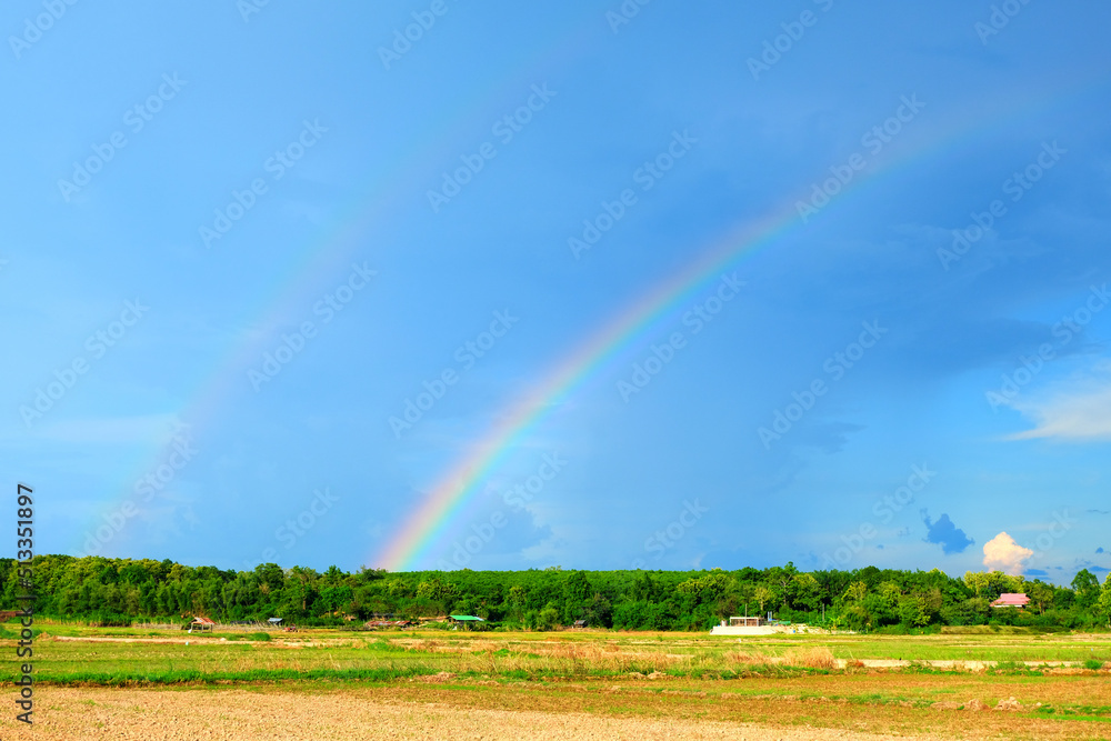 The countryside while it is raining and sunny, rainbow appear. The countryside while it is raining and sunny, rainbow appear.