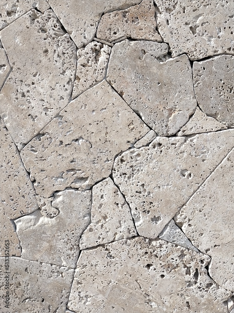 Fototapeta premium background of carved stones from the seabed with marks a, holes of the seabed of gray color