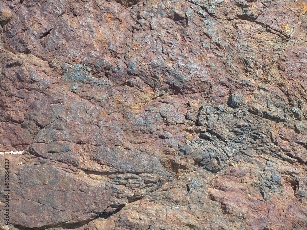 Background, texture of rust colored sea stone.