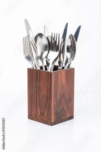 wooden stand with kitchen utensils, spoon, fork, knife