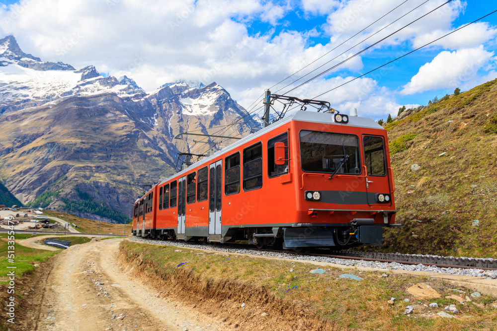 Beautiful view of the Swiss Alps with cogwheel train of Gornergrat railway close to Zermatt, Switzerland