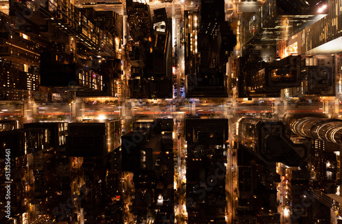 Canvas Print Top down shot of illuminated streets among blocks of town development