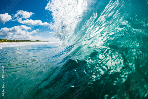 Beachbreak waves in ocean. Breaking barrel wave with sunshine © artifirsov