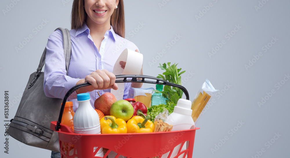 Smiling woman doing grocery shopping Smiling woman doing grocery shopping