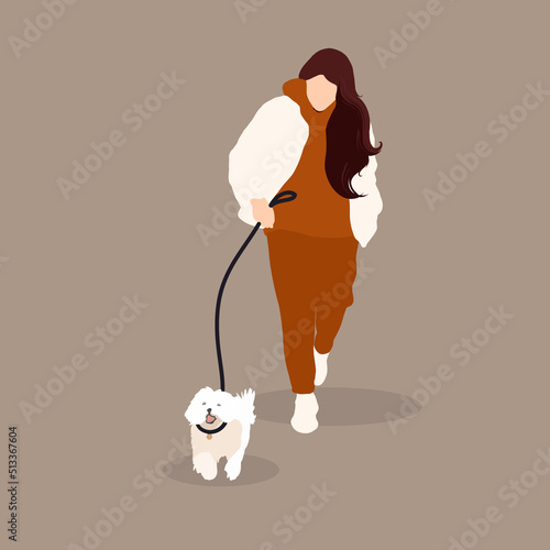 Woman walks with her dog on a leash