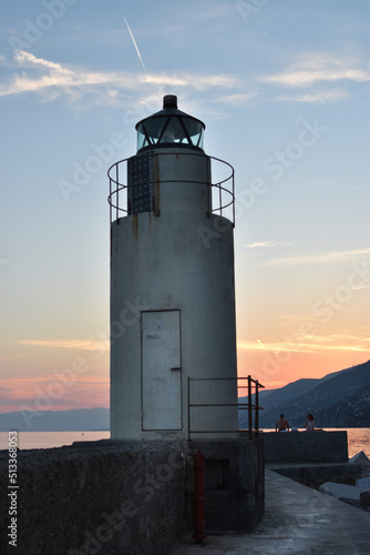 The lighthouse with sunset over the sea
