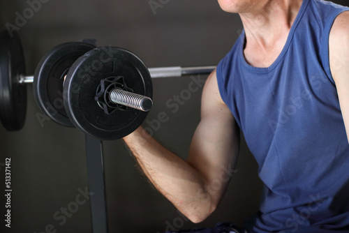 lifting dumbbells on a bench