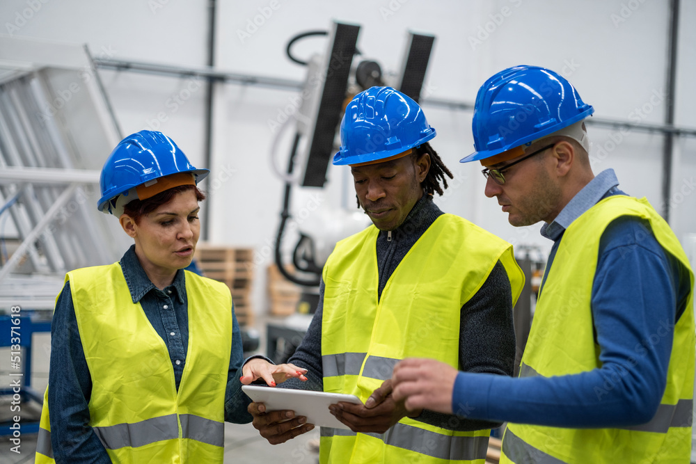 Three co-workers interacting to improve the operation of the factory Three co-workers interacting to improve the operation of the factory