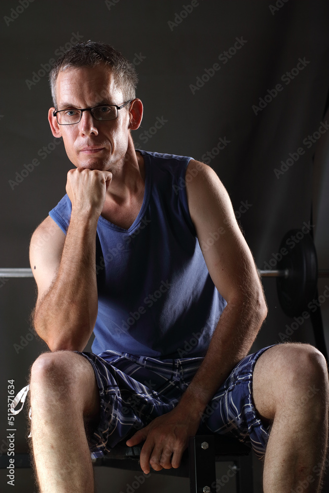 a person posing on an exercise bench a person posing on an exercise bench