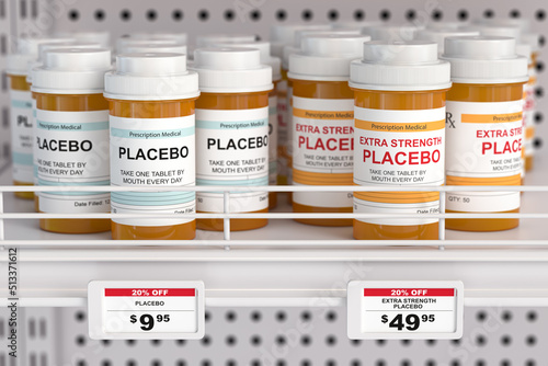 Placebo and extra strength placebo pills in box for different prices. Fraudulent earnings of the pharmaceutical industry concept. photo
