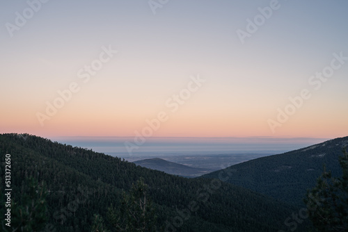 Foggy valley at dawn, with beautiful tones in the clear sky