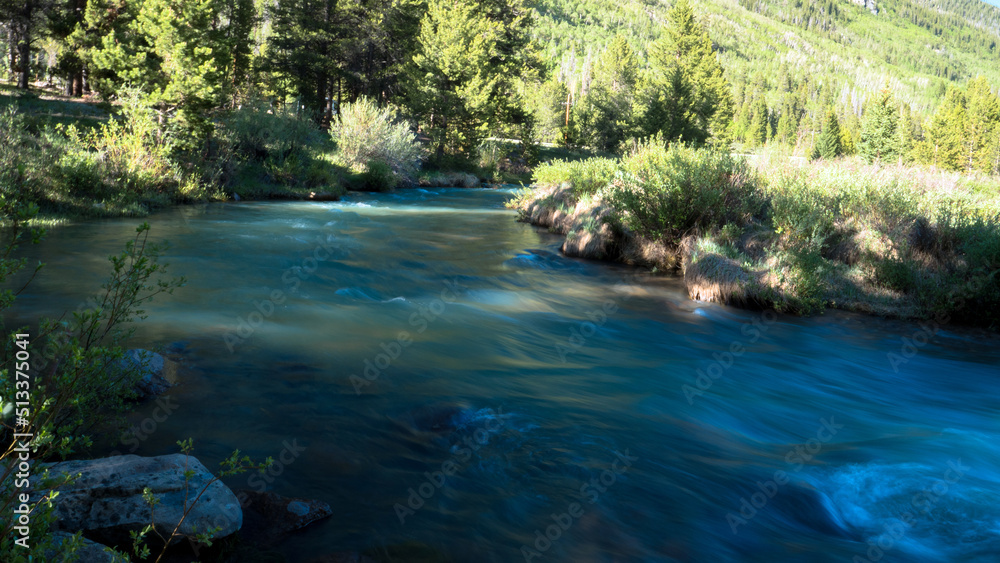 Naklejka premium Smooth water on the Snake River in White River National Forest in Colorado