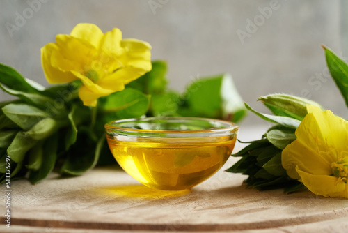 Evening primrose oil with fresh evening primrose flowers