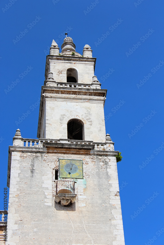 Tower of the Cathedral of San Ildefonso on the main square Plaza Grande in Merida, Yucatan peninsula, Mexico. It is first cathedral finished on the American mainland